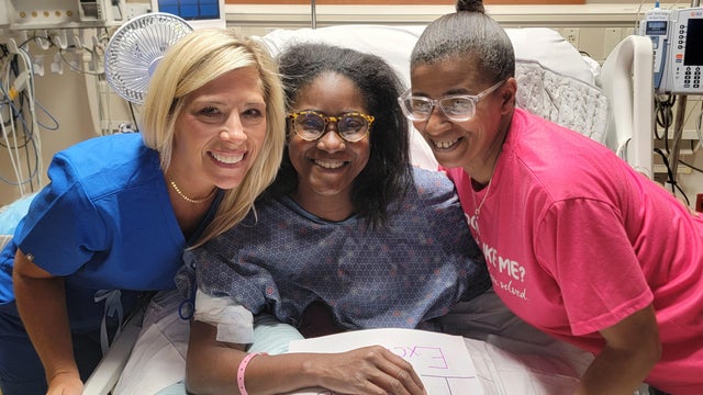 LaQuayia "LQ" Goldring smiles from her hospital bed 
