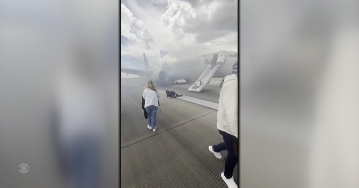 Investigation begins after passengers evacuate burning plane in Denver