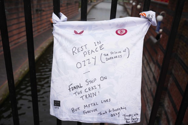A tribute is seen on the Black Sabbath Bridge in Birmingham, England, July 24, 2025, in memory of Ozzy Osbourne. 