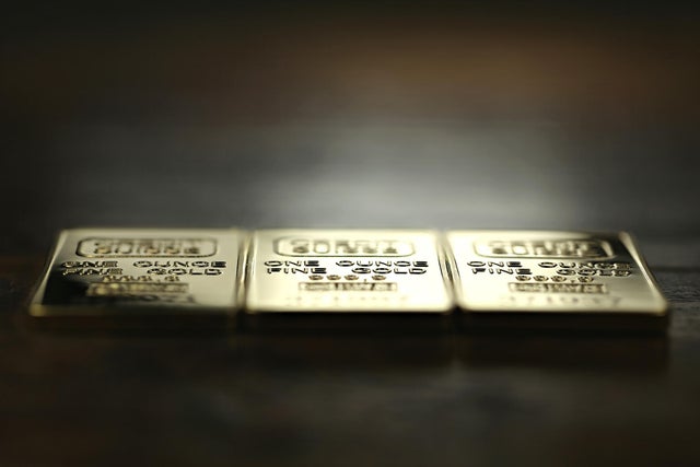 three 1 ounce gold ingots