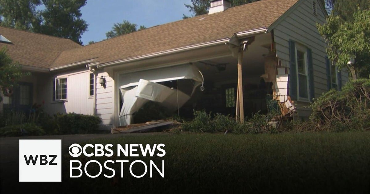 Driver taken to hospital after crashing pickup truck into home's garage ...