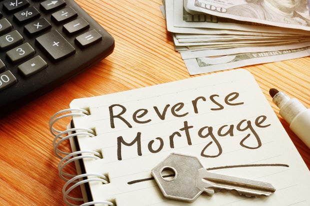 Text sign showing hand written words reverse mortgage 