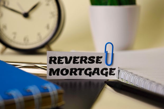 Reverse Mortgage on the paper isolated on it desk. Business and inspiration concept 