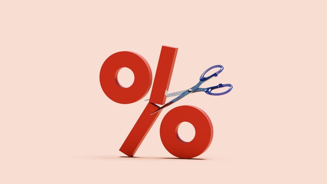 Percentage sign cut in half by scissor 