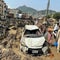 More than 220 people have died in Pakistan after flash floods, landslides
