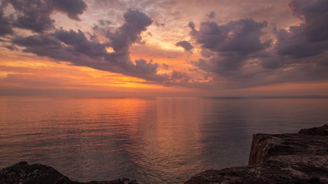 Madeline Island Sunrise,Scenic view of sea against dramatic sky during sunset,Madeline Island,Wisconsin,United States,USA 