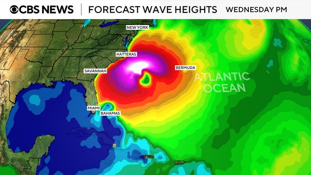A map shows forecast wave heights along the U.S. East Coast from Hurricane Erin 