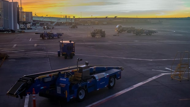 Southwest terminal at Denver International Airport at dusk against the sunset sky