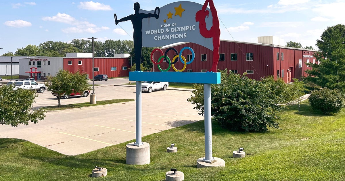 Former coach at prominent U.S. gymnastics academy arrested by FBI years after reports of abuse
