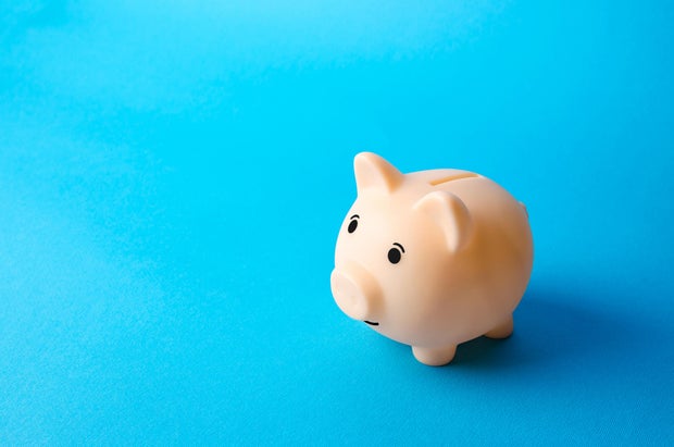 Piggy slope connected a bluish background. Economy. Pension fund. Deposit banking. Earn much wealth and prevention assets from ostentation risks. Financial literacy, astute wealth management. Savings programme
