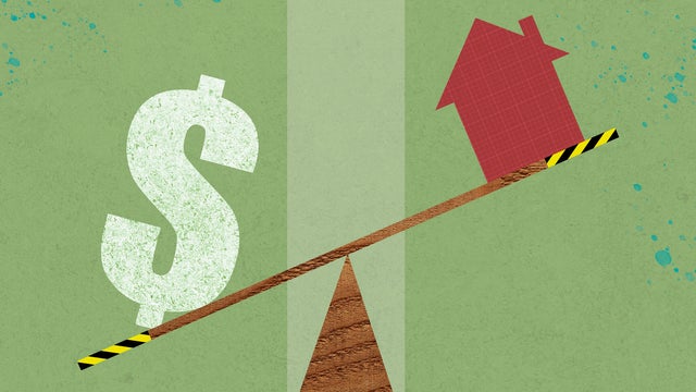 A house and a dollar symbol on a seesaw 