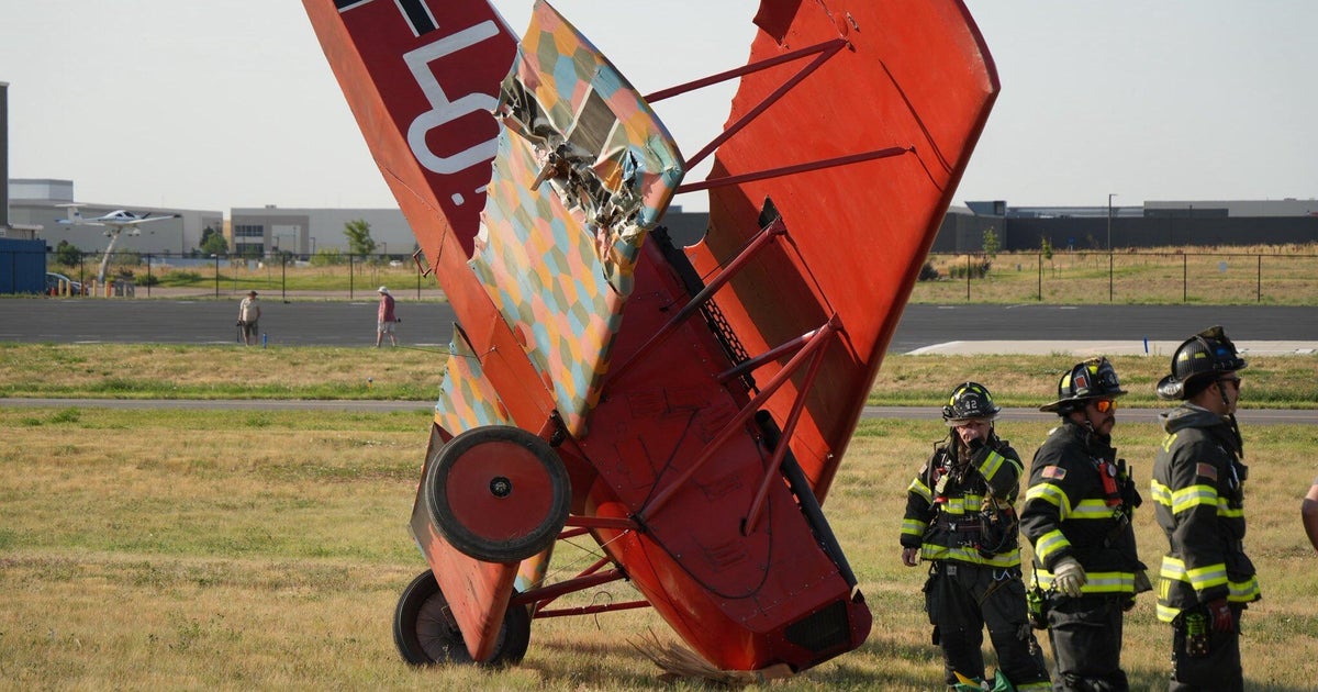 Single-engine biplane lands on nose after leaving Centennial Airport runway 