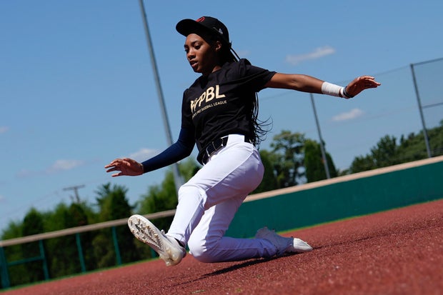 Mo'ne Davis slides to third base during the first day of tryouts for the Women's Professional Baseball League 