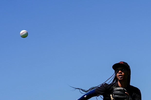 Mo'ne Davis watches the ball during an outfielder drill at the first day of tryouts for the Women's Professional Baseball League 