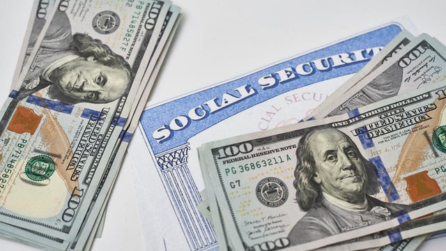 Social security card and us dollars cash money 