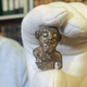 Smiling mini-figurine thought to be first Viking "portrait" unveiled in Denmark 
