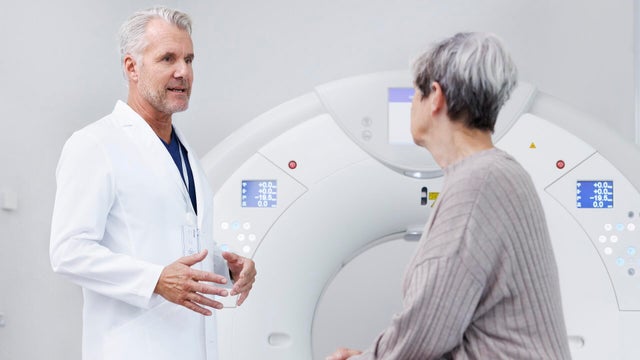 Doctor in conversation with eating before medical scan