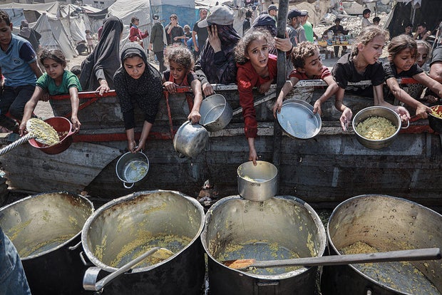 A hot meal distributed to the Palestinians who struggle with hunger in Gaza 