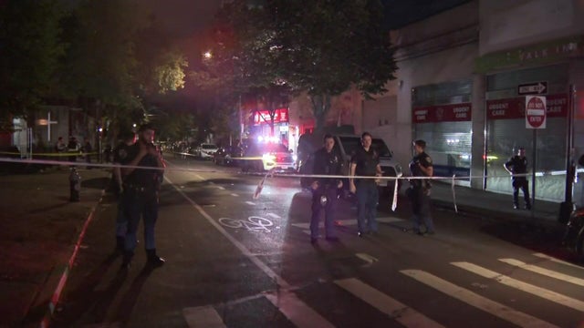 Crime scene tape and NYPD block off a Bronx street 