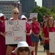Protesters demand stricter gun control laws after mass shooting 