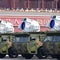 What new weapons did China show off in its massive military parade?