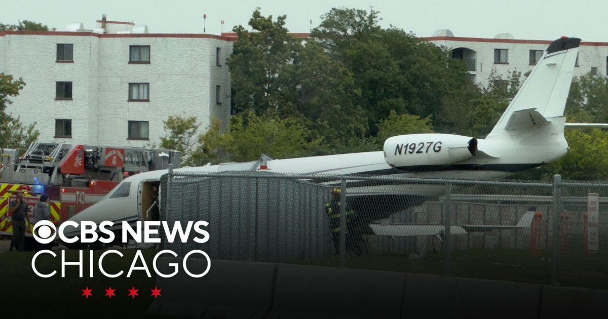 Small plane crashes through fence at Chicago Executive Airport - CBS ...