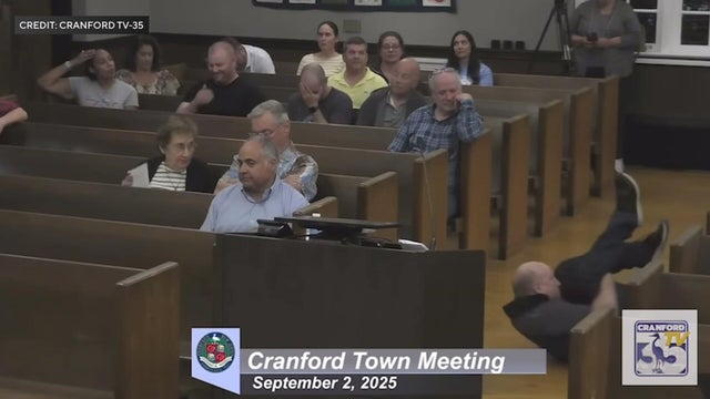 Will Thilly doing a backspin at a town hall meeting 