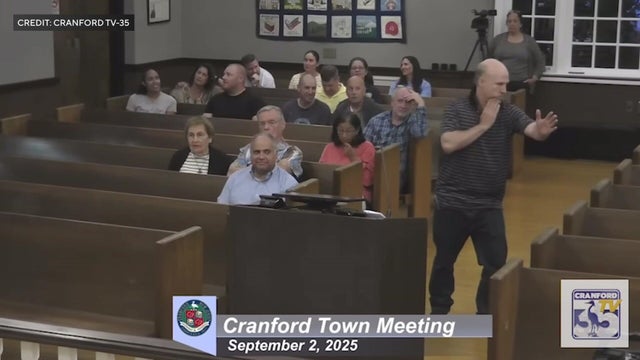 Will Thilly breakdancing at a town hall meeting 