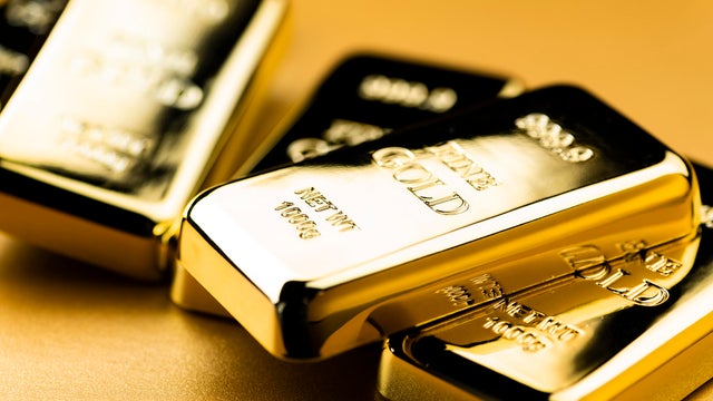 Image of Gold Ingots on Golden Background 