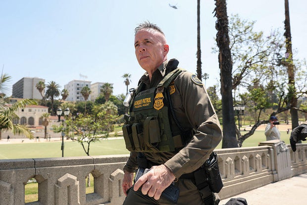 Gregory Bovino walks as a large group of federal law enforcement officers arrive at MacArthur Park in Los Angeles on July 7, 2025. 