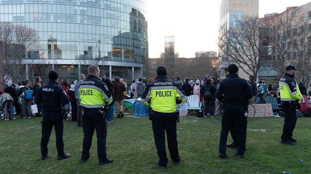 Northeastern University police stand on the sides of the 