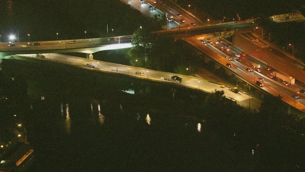 Chopper 3 image of the MLK Bridge in Philadelphia, a few work vehicles and lights are on the bridge 