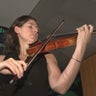 Magee Capsuoto plays her violin in the Great Hall at CBS News Philadelphia 