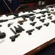 Dozens of weapons seized in Queens gun trafficking ring takedown, police say 