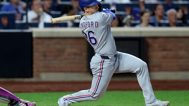 Wyatt Langford #36 of the Texas Rangers drives in a run in the ninth inning against the New York Mets at Citi Field on September 13, 2025 in the Flushing neighborhood of the Queens borough of New York City. 
