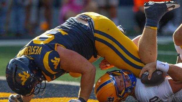 PHOTOS: West Virginia completes comeback, beats Pitt in overtime to win Backyard Brawl 