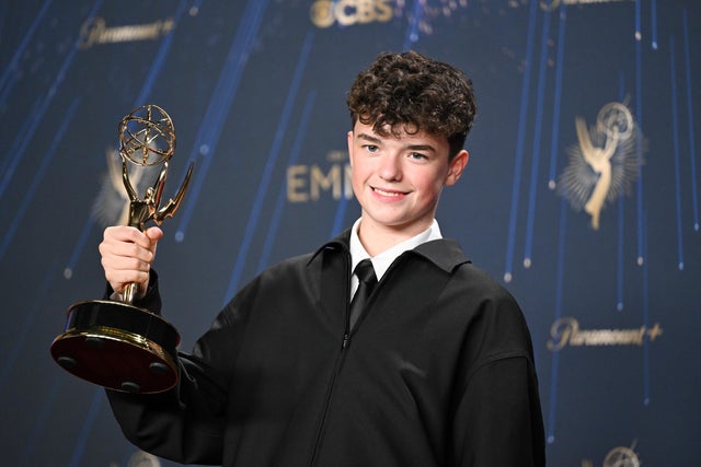 Owen Cooper poses with his Emmy 