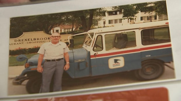 Jimmy Morris stands in front of the Drexelbrook apartments with his mail truck