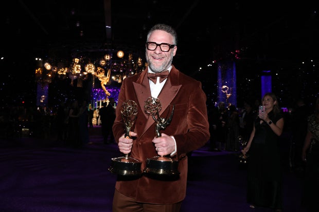 Seth Rogen holding his Emmy Awards 