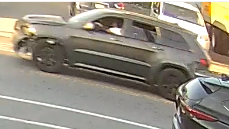 A dark-colored Jeep Grand Cherokee 