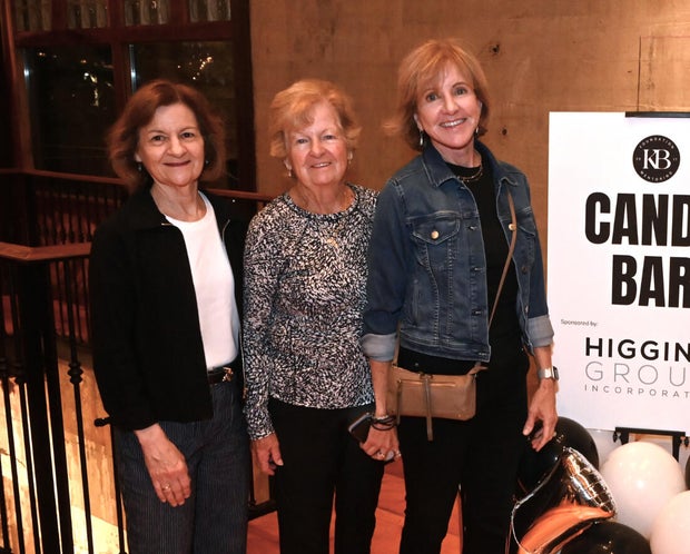 People pose for photos during the KB Foundation's BBQ Experience event