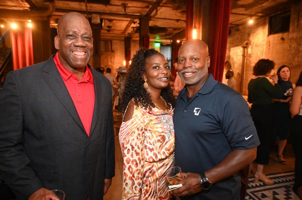 People pose for photos during the KB Foundation's BBQ Experience event