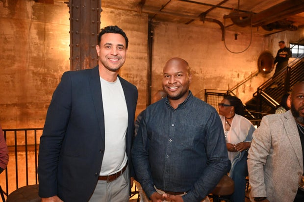 People pose for photos during the KB Foundation's BBQ Experience event