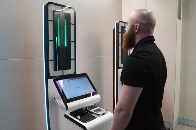 A person gets their picture taken at an Entry/Exit System kiosk during a preview of the system at St. Pancras Station in London, Sept. 3, 2025. 