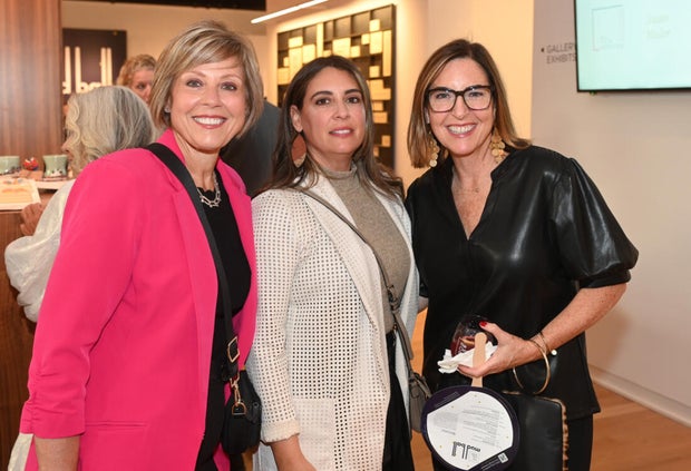 People pose for photos at Mud Ball 2025