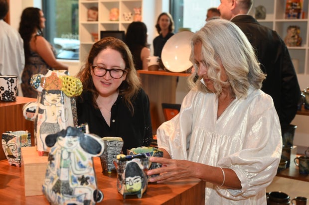 People pose for photos at Mud Ball 2025