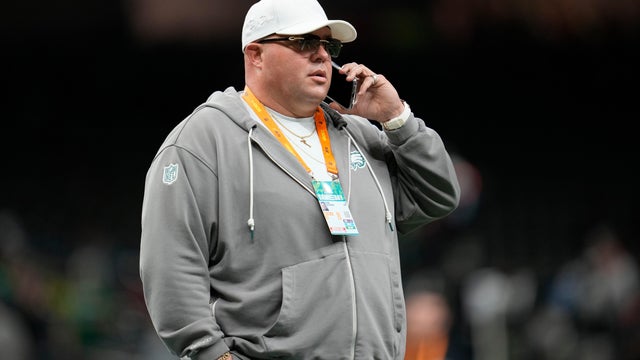 Philadelphia Eagles chief security officer Dom DiSandro stands on the field before the NFL Super Bowl 59 football game against the Kansas City Chiefs, he's using a cellphone in this photo from 2025 