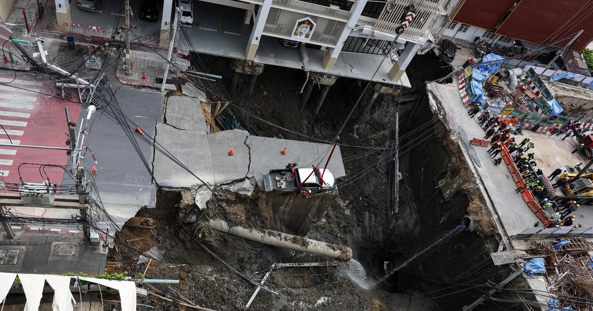Large sinkhole swallows a part of a Bangkok highway, forcing evacuations in Thailand’s capital