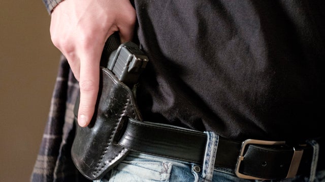 Man with Handgun in Holster 
