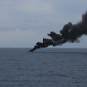Coast Guard releases image of alleged drug boat on fire after seizures 